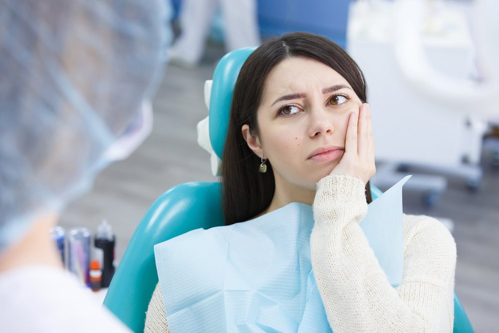 Болит зуб после лечения: симптомы и причины.